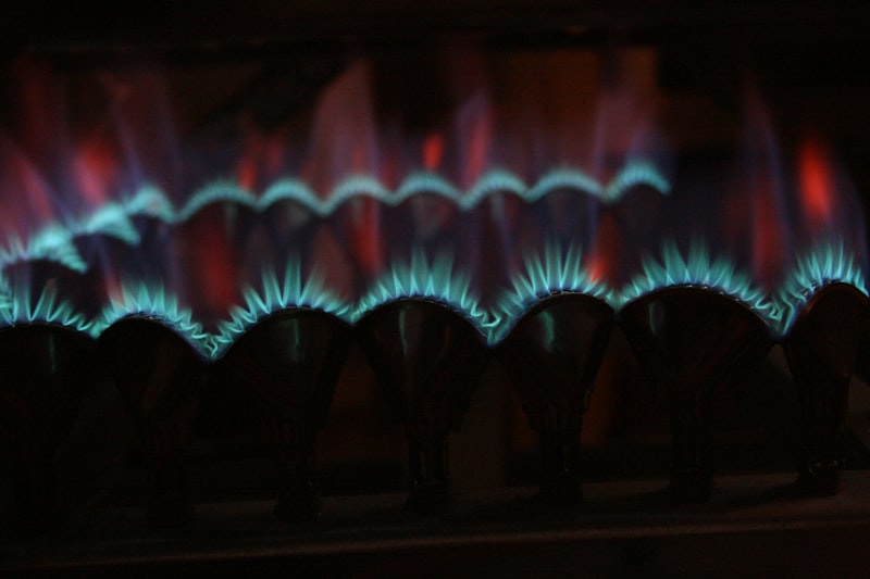 Blue flames inside a gas furnace burner