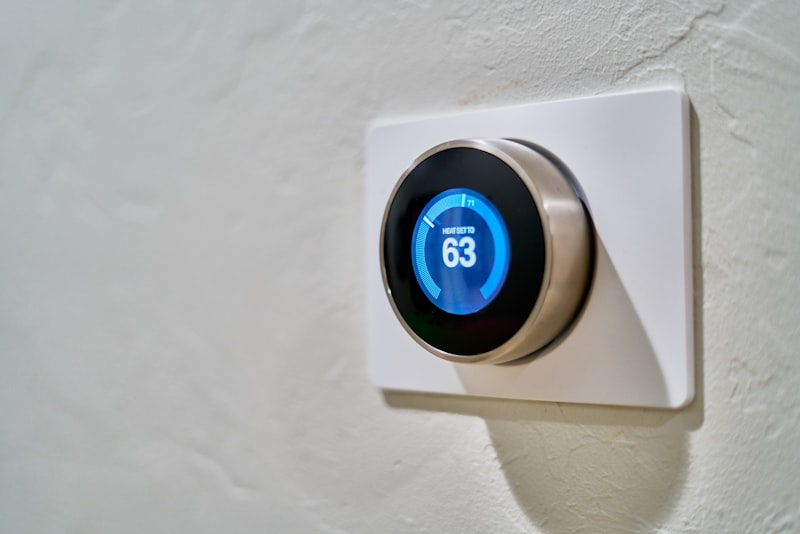 Modern smart thermostat on a wall