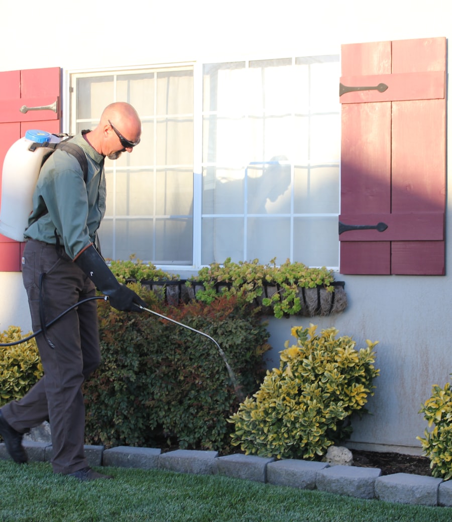 Pest control technician treating a home