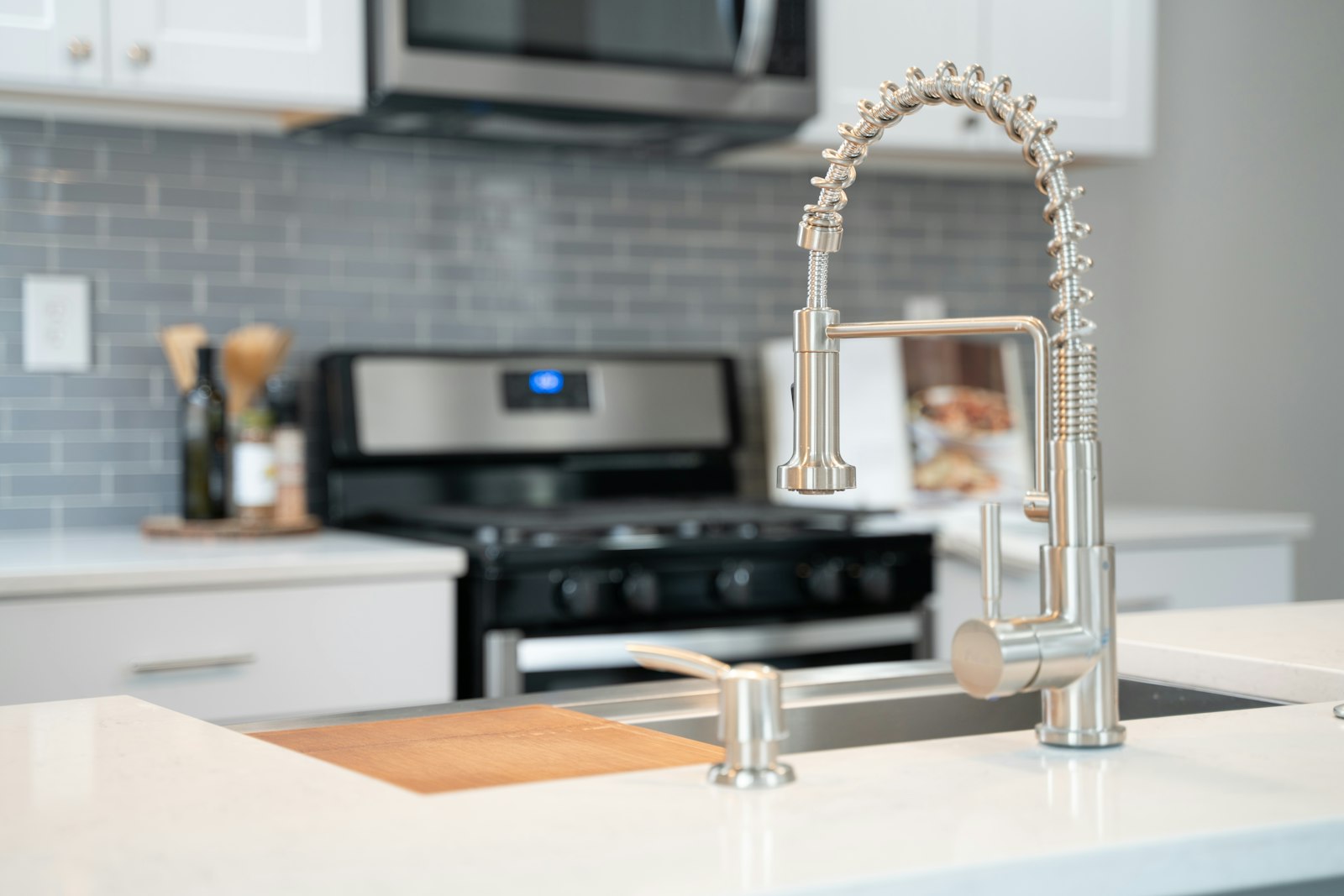 Modern kitchen faucet installed by a professional plumber