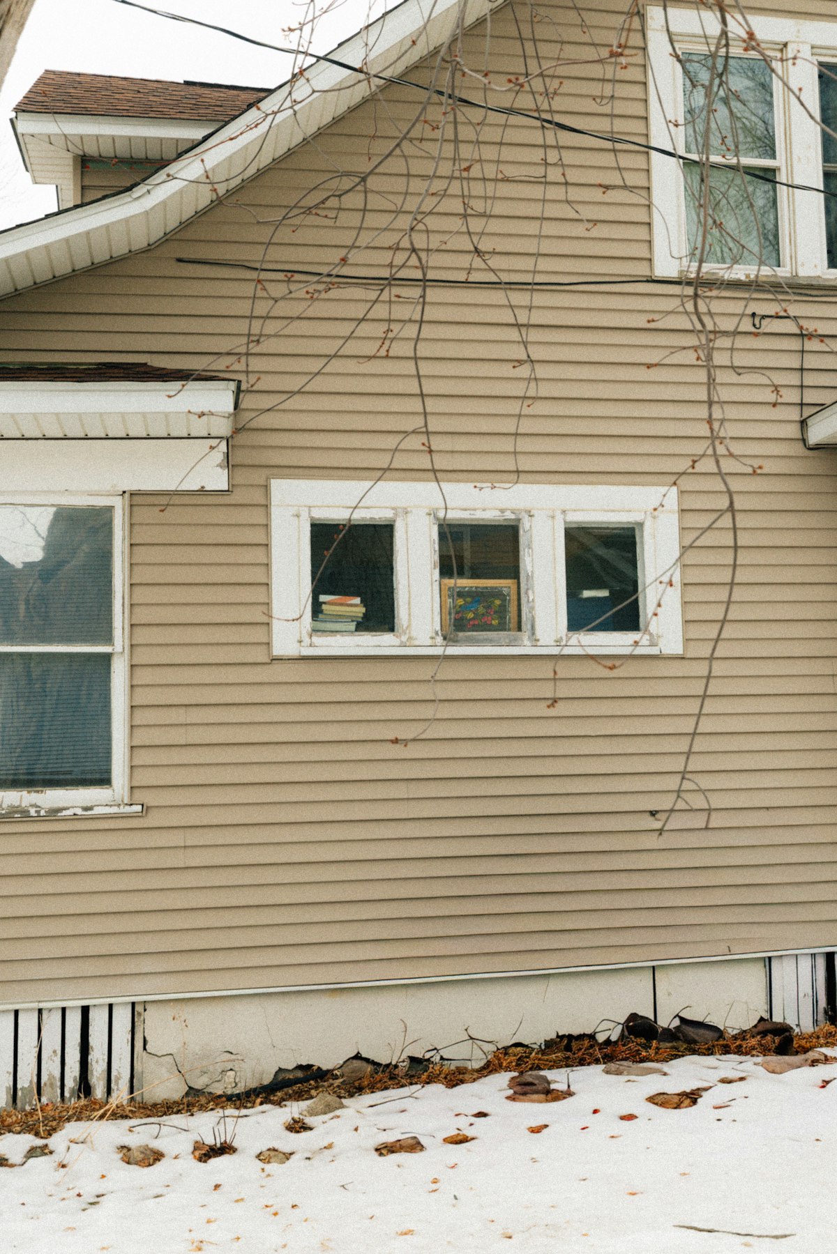 Technician installing a new replacement window